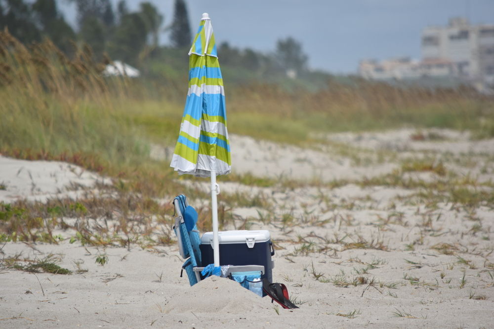 Beach,Umbrella,Chair,And,Cooler,On,Sand, Rental